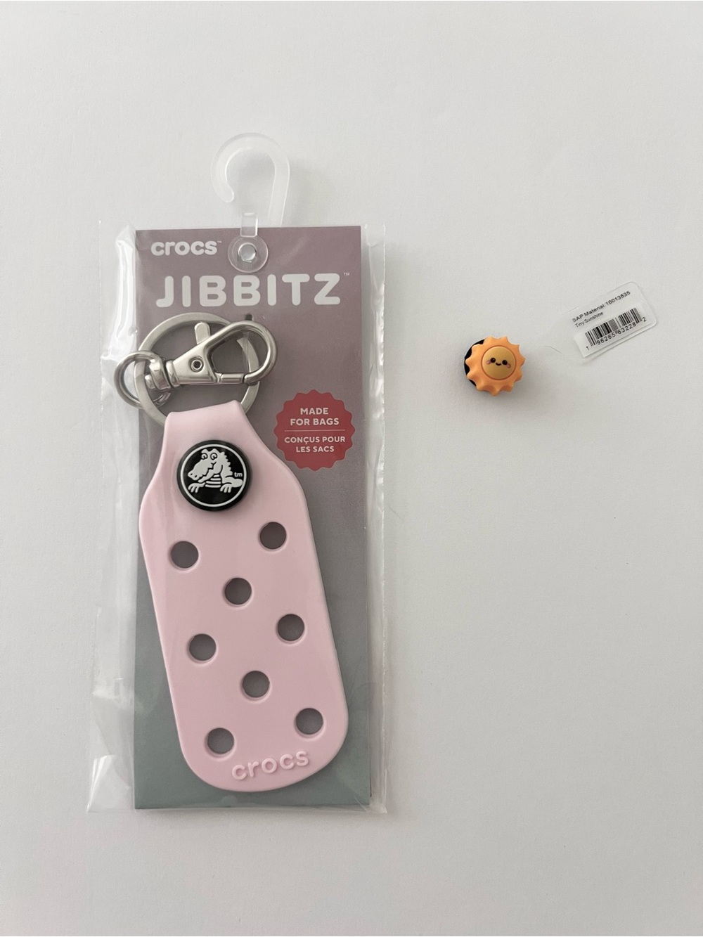 Crocs Jibbitz Bag Charm Keychain in Pink and Jibbitz Tiny Sunshine charm